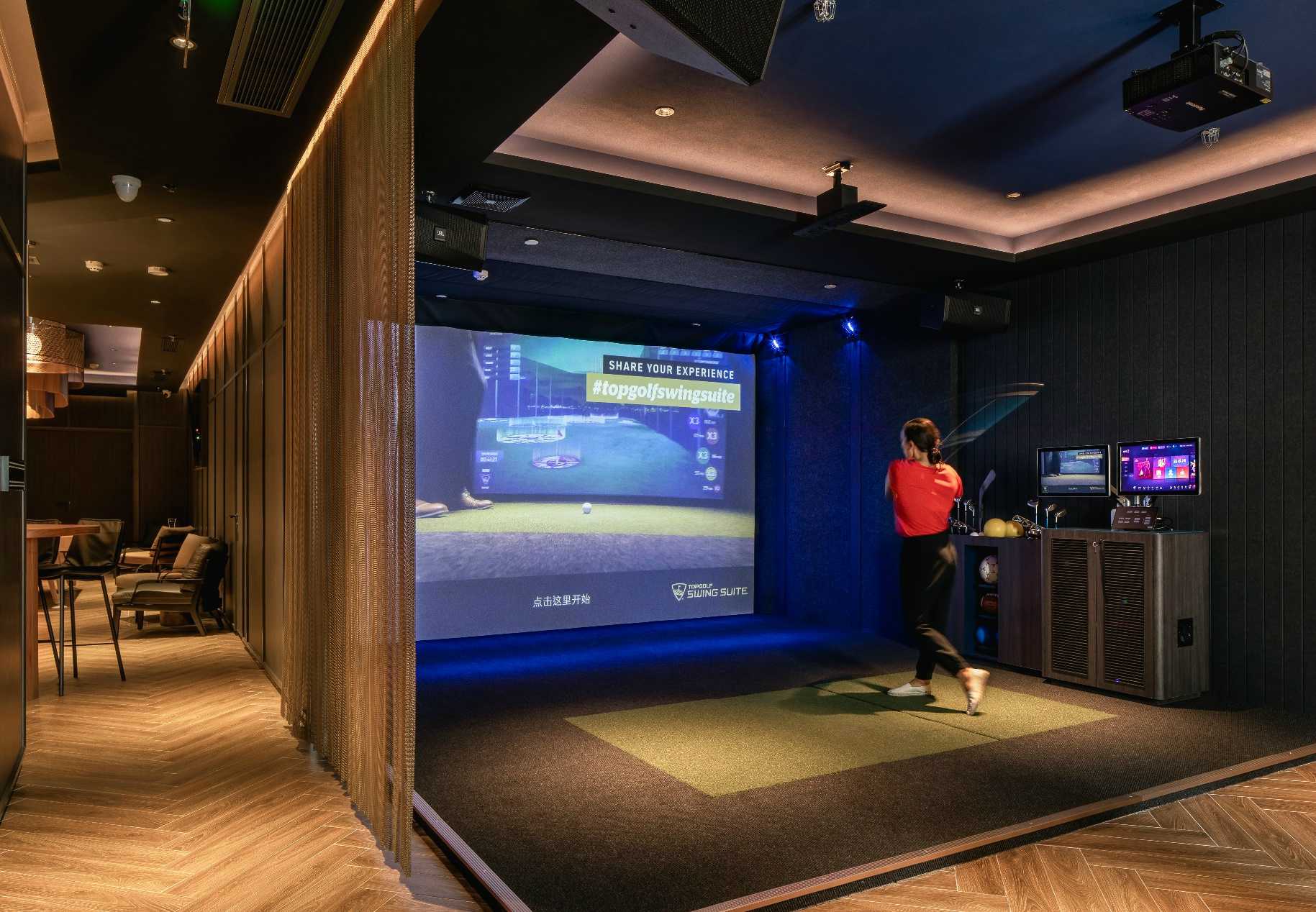 Guests choosing a game at Topgolf